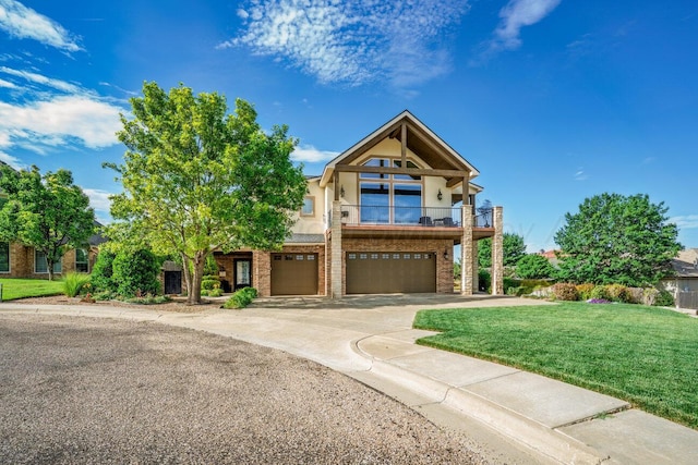 27 Carnoustie Ln, Amarillo, TX 79124 - view of front of property featuring a garage, a front yard, stucco siding, driveway, and a balcony