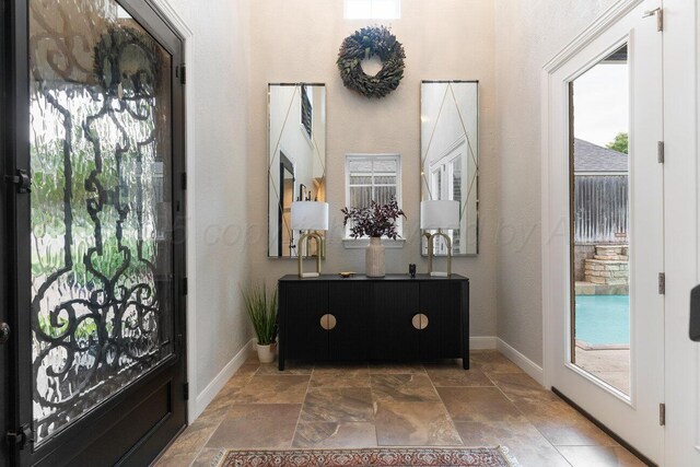 27 Carnoustie Ln, Amarillo, TX 79124 - foyer featuring stone tile flooring and baseboards