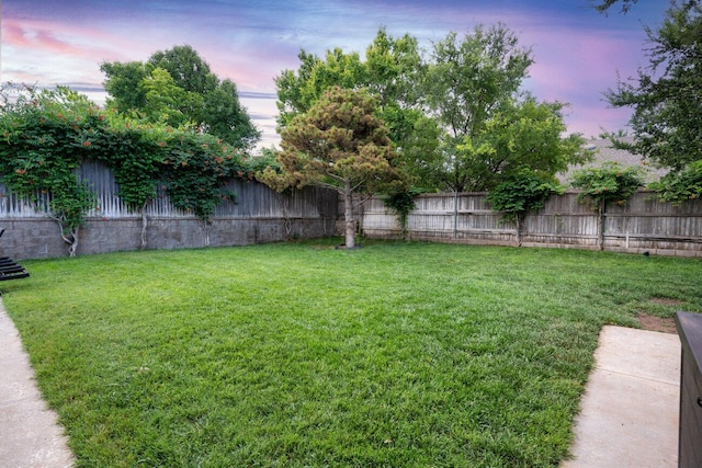 27 Carnoustie Ln, Amarillo, TX 79124 - yard at dusk with a fenced backyard
