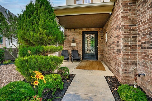 27 Carnoustie Ln, Amarillo, TX 79124 - entrance to property with brick siding and a porch