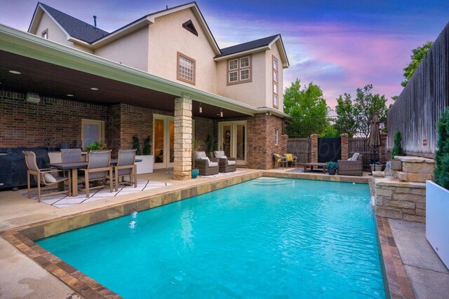 27 Carnoustie Ln, Amarillo, TX 79124 - pool at dusk featuring a patio area and a fenced backyard