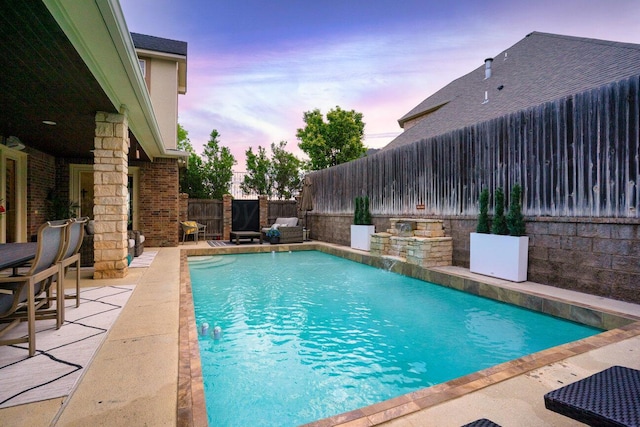 27 Carnoustie Ln, Amarillo, TX 79124 - pool at dusk featuring a patio area and a fenced backyard