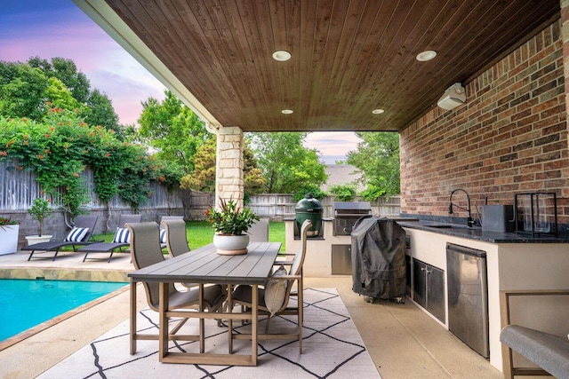 27 Carnoustie Ln, Amarillo, TX 79124 - fenced backyard with an outdoor kitchen, a patio, and outdoor dining area