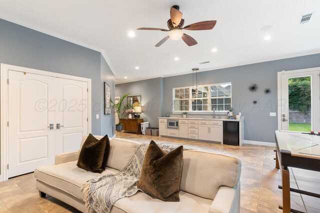 27 Carnoustie Ln, Amarillo, TX 79124 - living room featuring crown molding, ceiling fan, and recessed lighting