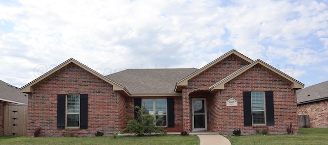 9807 Will Ave, Amarillo, TX 79119 - ranch-style house featuring brick siding and a front lawn