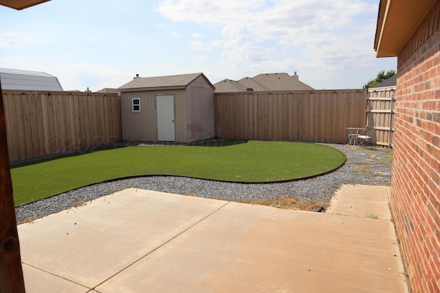 9807 Will Ave, Amarillo, TX 79119 - fenced backyard featuring a patio and a storage unit
