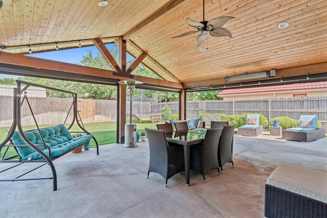 3523 Rutson Dr, Amarillo, TX 79109 - fenced backyard with a patio, outdoor dining space, and a ceiling fan