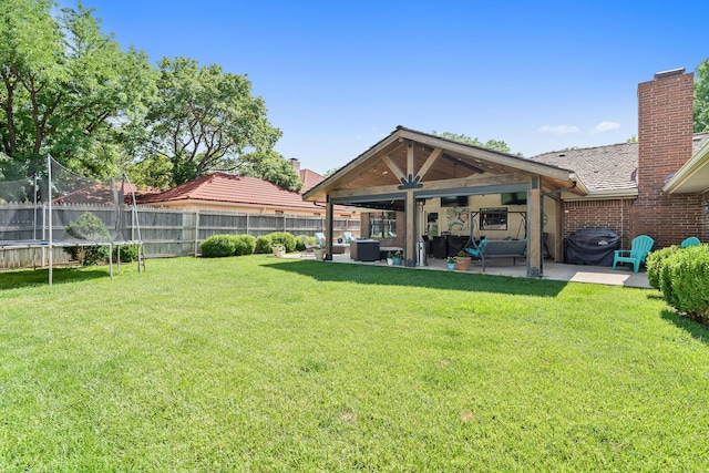 3523 Rutson Dr, Amarillo, TX 79109 - view of yard featuring outdoor lounge area, a patio area, and a trampoline