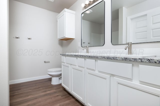 10502 Ruse St, Amarillo, TX 79118 - full bathroom featuring double vanity and wood finished floors