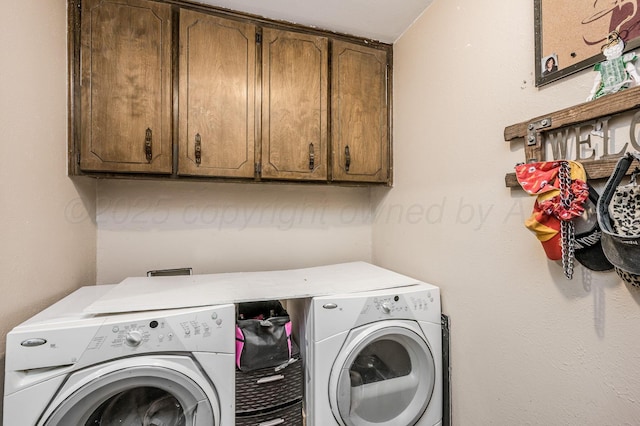 washroom with cabinets and separate washer and dryer