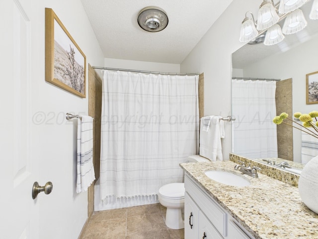 full bathroom featuring vanity, tile patterned floors, a textured ceiling, a shower with curtain, and toilet