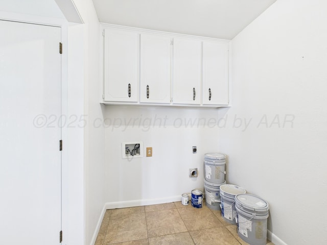 laundry room with hookup for an electric dryer, baseboards, washer hookup, and cabinet space