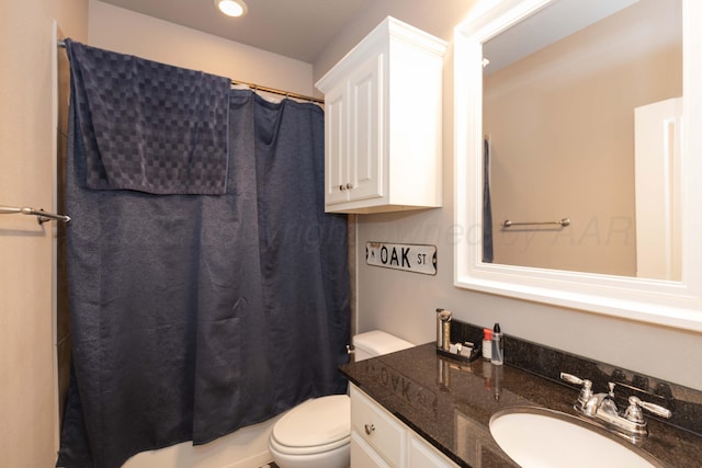 full bathroom featuring toilet, vanity, and recessed lighting