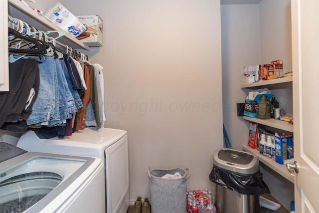 laundry area with washing machine and clothes dryer