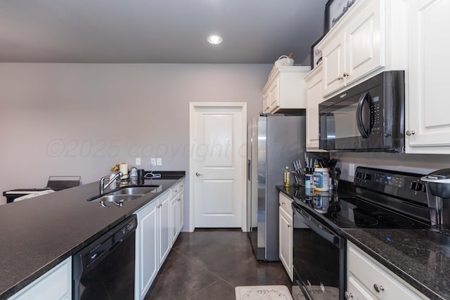 kitchen with black appliances, a sink, white cabinetry, recessed lighting, and dark stone counters