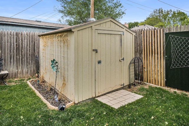 view of shed with fence