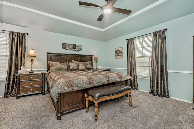 bedroom with light carpet, a ceiling fan, and baseboards