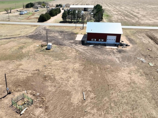 birds eye view of property featuring a rural view