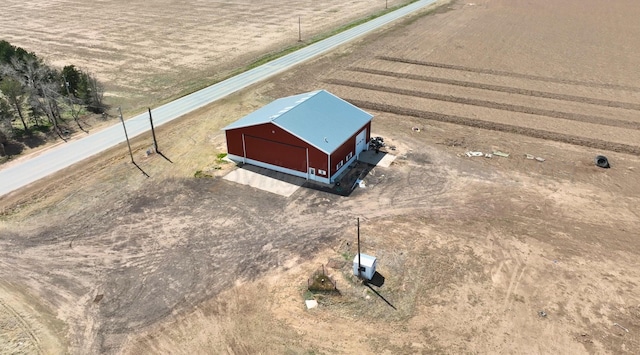 birds eye view of property featuring a rural view