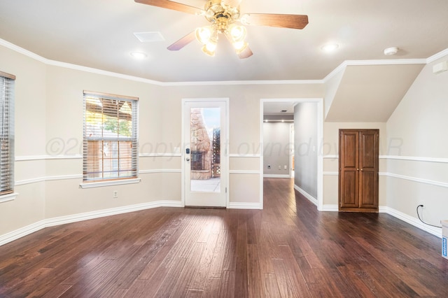 spare room featuring dark wood-type flooring, ceiling fan, and ornamental molding