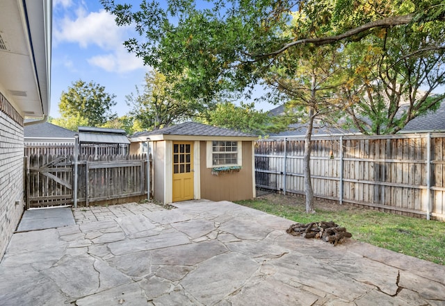 view of patio / terrace with a shed