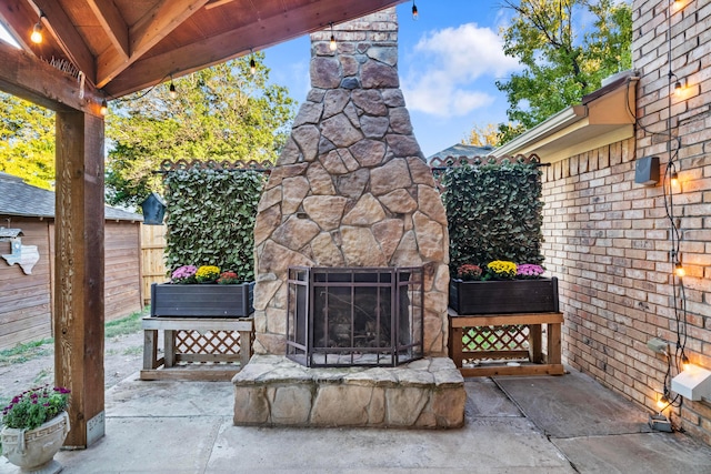 view of patio / terrace with an outdoor stone fireplace