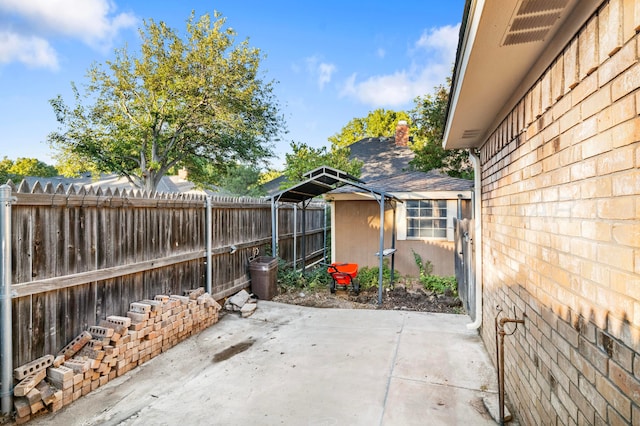 view of patio / terrace featuring an outbuilding