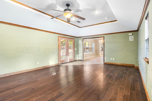 empty room with hardwood / wood-style floors, ceiling fan, crown molding, and french doors