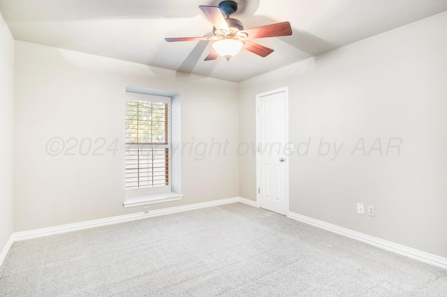 empty room featuring ceiling fan and carpet floors