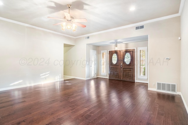 foyer entrance with ornamental molding, dark wood-type flooring, and ceiling fan