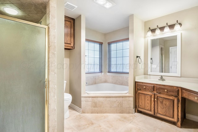 full bathroom with toilet, vanity, tile patterned floors, and separate shower and tub