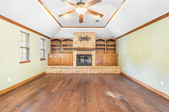 unfurnished living room with dark wood-type flooring, ornamental molding, ceiling fan, and built in shelves