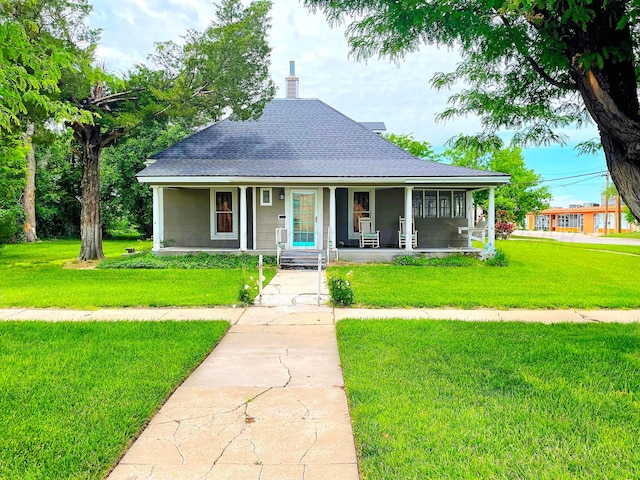 view of front of house featuring a porch and a front lawn