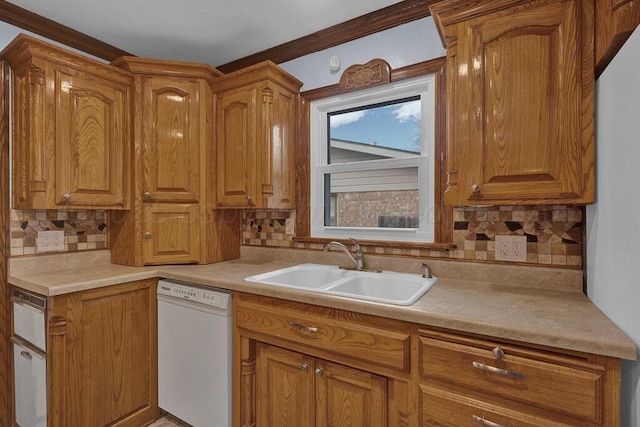 kitchen with tasteful backsplash, white dishwasher, a sink, light countertops, and brown cabinets