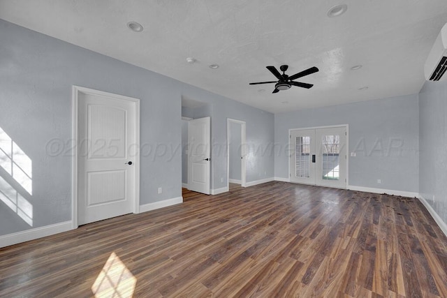 interior space featuring dark wood-type flooring, french doors, and baseboards