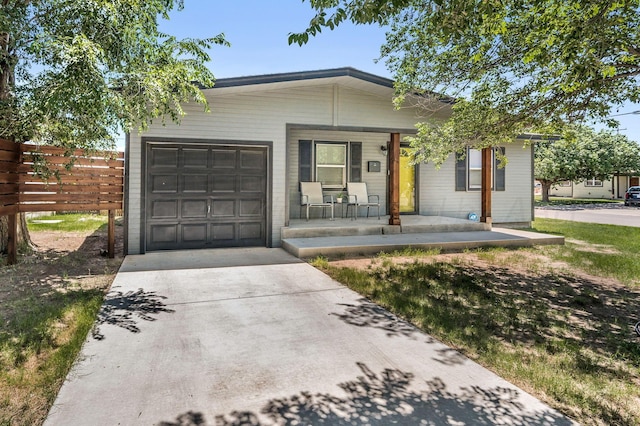 4639 S Hughes St, Amarillo, TX 79110 - ranch-style house with covered porch, driveway, and a garage