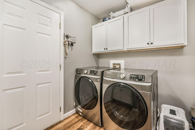 4639 S Hughes St, Amarillo, TX 79110 - washroom with cabinet space, washing machine and clothes dryer, and light wood-type flooring