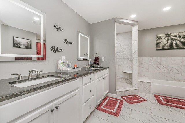 4639 S Hughes St, Amarillo, TX 79110 - full bath featuring marble finish floors, a bath, double vanity, walk in shower, and recessed lighting