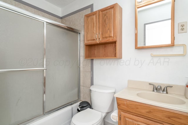 1608 Heather St, Amarillo, TX 79107 - bathroom with vanity, toilet, and bath / shower combo with glass door