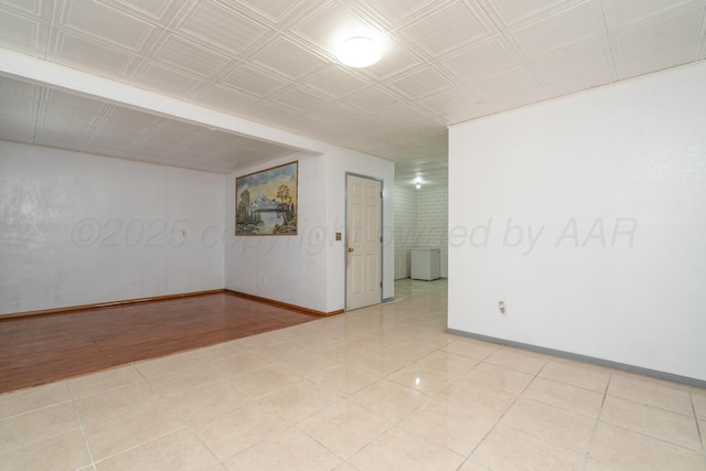 1608 Heather St, Amarillo, TX 79107 - empty room with baseboards and light tile patterned floors