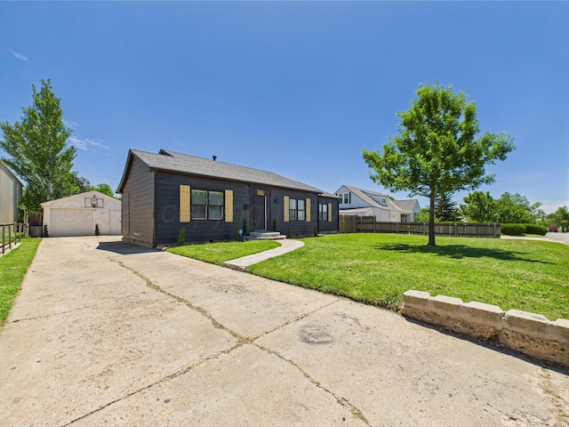 1206 N Russell St, Pampa, TX 79065 - view of front of home featuring an outdoor structure, a detached garage, and driveway
