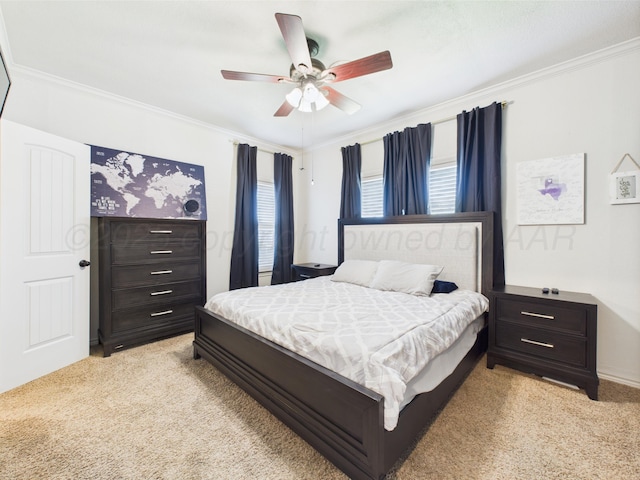 1206 N Russell St, Pampa, TX 79065 - bedroom with light colored carpet, ornamental molding, and ceiling fan