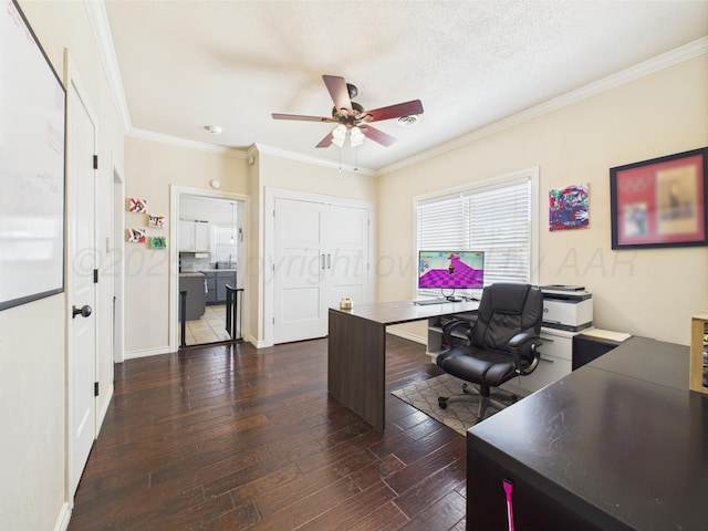 1206 N Russell St, Pampa, TX 79065 - home office with a ceiling fan, dark wood-type flooring, crown molding, and baseboards