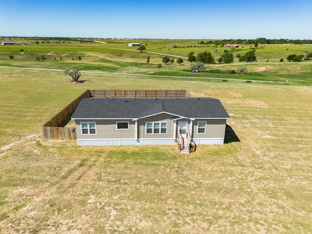 back of house with a rural view