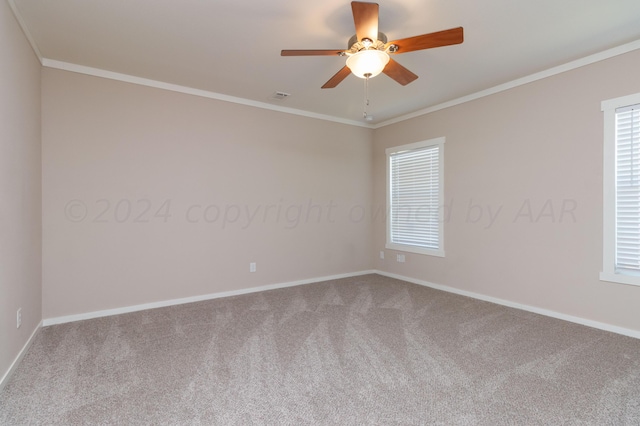 unfurnished room with ceiling fan, carpet floors, and ornamental molding