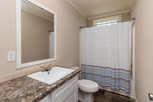 bathroom with wood-type flooring, vanity, toilet, and crown molding