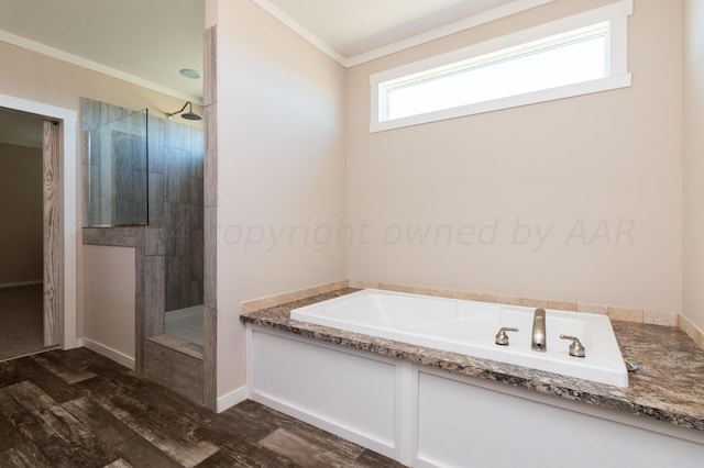 bathroom with ornamental molding, hardwood / wood-style floors, and separate shower and tub