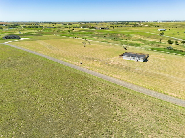 birds eye view of property with a rural view