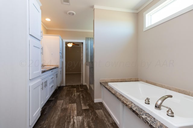 bathroom featuring hardwood / wood-style floors, vanity, crown molding, and plus walk in shower