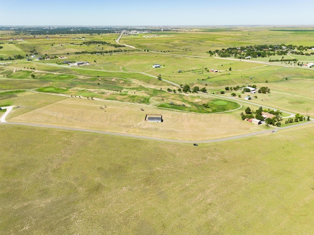 birds eye view of property with a rural view